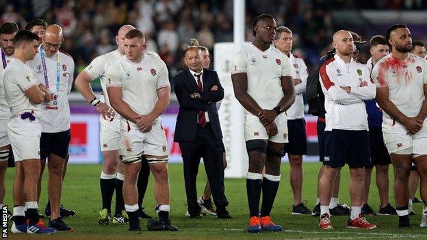 Eddie Jones stands with his England players after the World Cup final defeat by South Africa