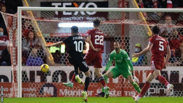 Abdellah Zoubir smashes in Qarabag's third goal at Pittodrie