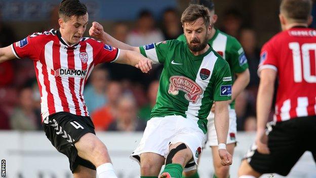 Aaron McEneff tries to win the ball for Derry City against Cork's Greg Bolger