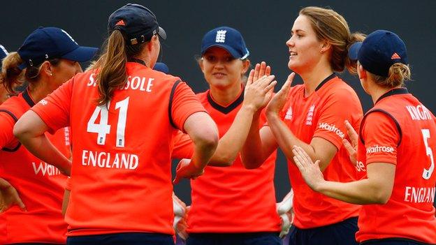 England celebrate a wicket by Natalie Sciver (second right)