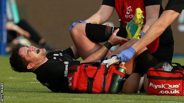 Saracens captain Brad Barritt gets treatment for an ankle injury