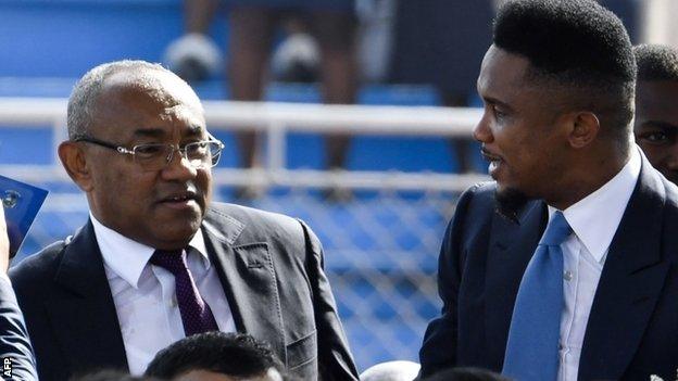 CAF President Ahmad (L) and former Cameroon striker Samuel Eto'o