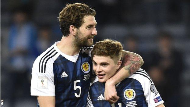 Charlie Mulgrew celebrates Scotland's win over Slovenia with James Forrest