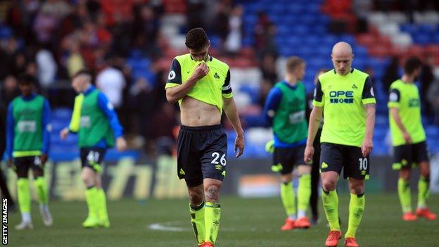 Huddersfield player Christopher Schindler looks dejected after the final whistle