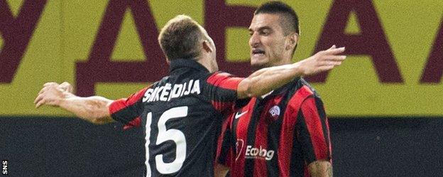 Blagoja Todorvski congratulates Shkendija scorer Hristijan Kirovski