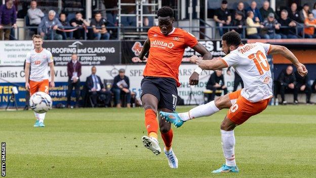 Blackpool's Keshi Anderson has a shot at Kenilworth Road