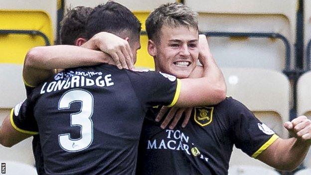 Livingston's Danny Mullen celebrates after making it 1-0