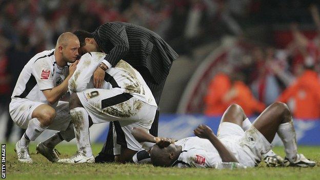 Adebayo Akinfenwa is consoled by Lee Trundle (left) and Roberto Martinez following Swansea's play-off defeat to Barnsley in 2006