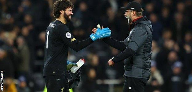 Liverpool manager Jurgen Klopp (right) with goalkeeper Alisson