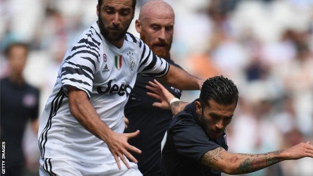 Lewis Page tangles with Gonzalo Higuain in West Ham United's pre-season friendly against Juventus