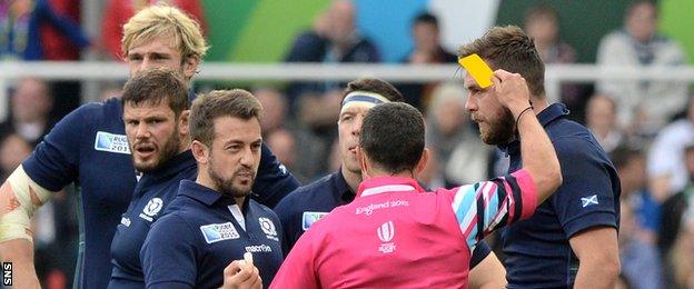 Scotland players with referee Jaco Peyper