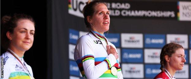 Ellen van Dijk stands on the podium