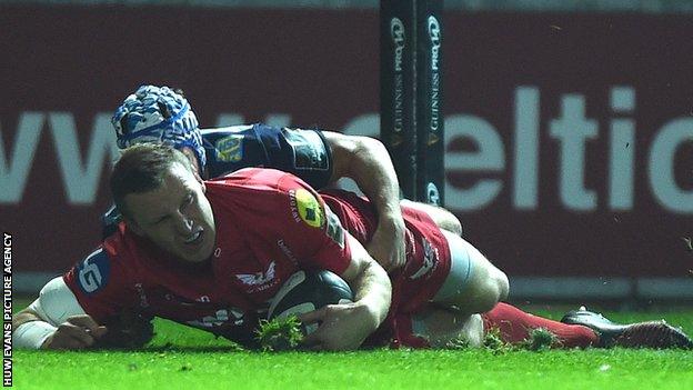 Hadleigh Parkes scores the opening try for Scarlets against Cardiff Blues