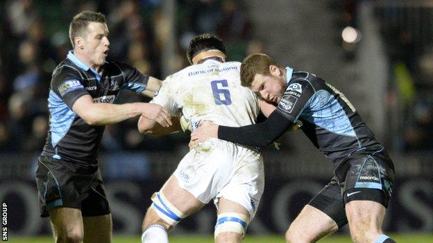 Glasgow Warriors' Mark Bennett (left) and Rory Clegg challenge Leinster's Dominic Ryan