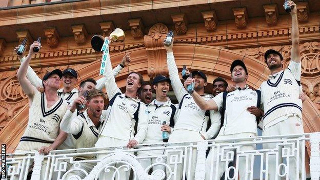 Middlesex's players celebrate winning the County Championship title