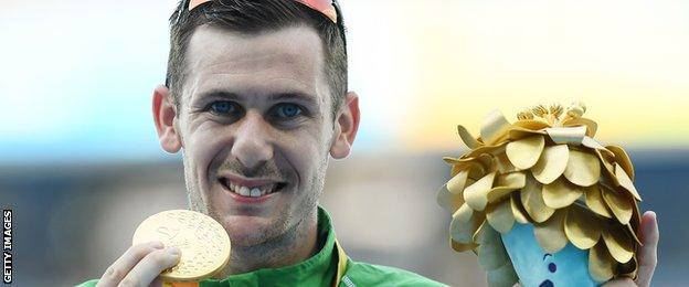 Michael McKillop shows off his Rio gold medal