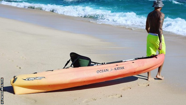 Lewis Hamilton with a kayak