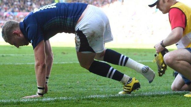 Finn Russell of Scotland sustains an injury