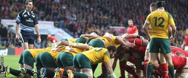 Australia, with Matt Giteau (12) filling in at scrum-half, pack down for a scrum against Wales