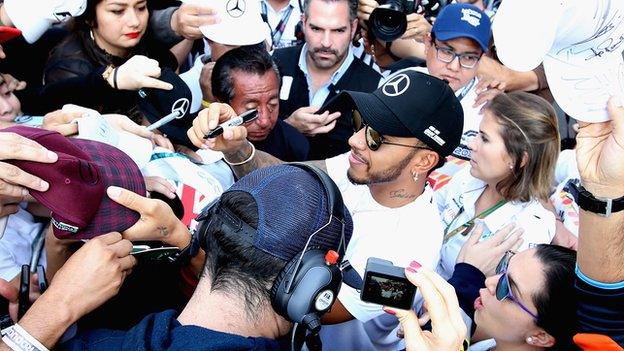 Lewis Hamilton signing autographs