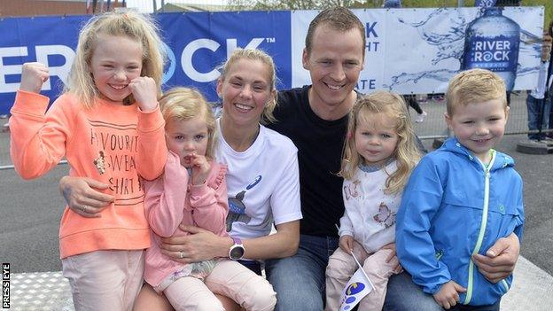 Laura Graham with husband Thomas and children Leila, Darcy, Payton and Jaden after her Belfast Marathon triumph