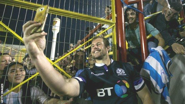 Scotland's Allan Dell takes a selfie with Argentina fans