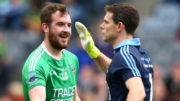 Sean Quigley smiles after Fermanagh's controversial first goal as Dublin keeper Stephen Cluxton protests