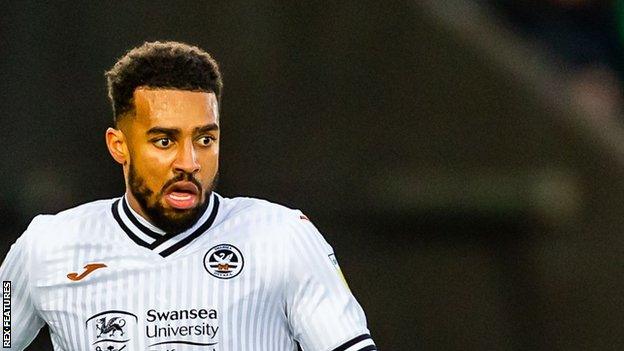 Cyrus Christie made 23 appearances for Swansea City during a loan spell with the Championship side last season