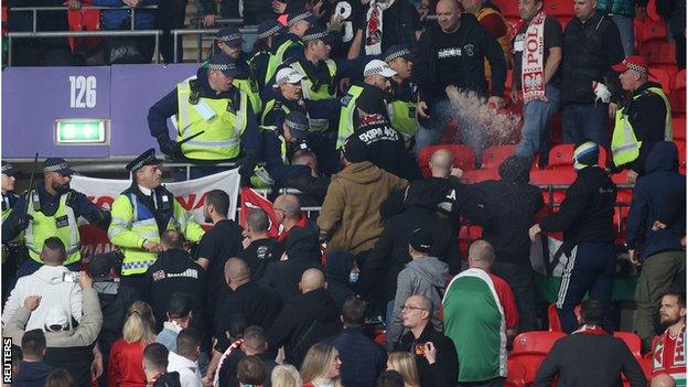 Fans clashed with stewards and police early in the game