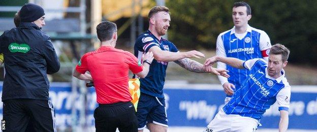 Ross County's Craig Curran pushes over St Johsntone's Steven MacLean