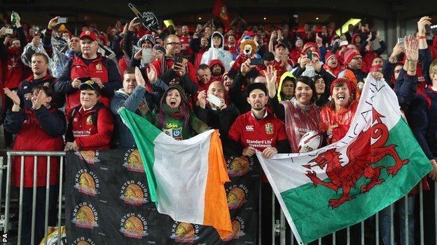 Fans wave the Welsh and Republic of Ireland flags at Eden Park