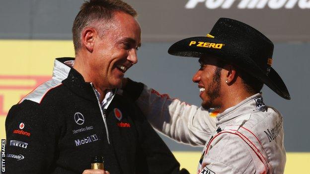 Martin Whitmarsh and Lewis Hamilton on the podium at the United States Grand Prix in 2012