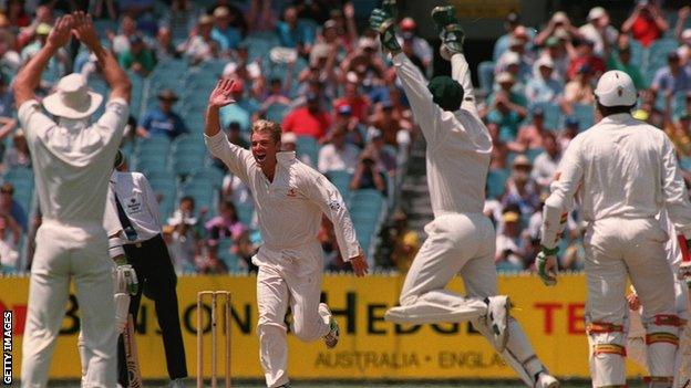 Shane Warne celebrates his hat-trick at Melbourne