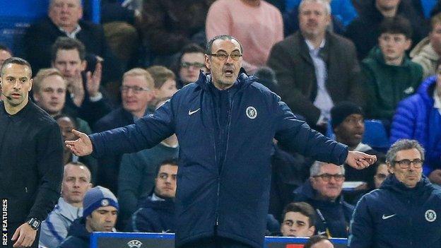 Maurizio Sarri spreads his arms wide to gesture to his players during Chelsea's Europa League second leg against Malmo