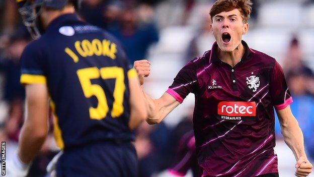 Somerset's Kasey Aldridge celebrates the wicket of Glamorgan's Joe Cooke