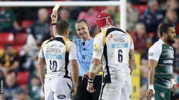 Jimmy Gopperth (left) was given a yellow card by referee Tim Wigglesworth at Welford Road, despite captain James Haskell's intervention