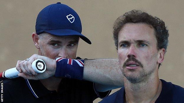 Jamie Murray and Bruno Soares discuss tactics in their Australian Open first-round match