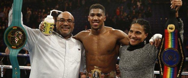 Anthony Joshua celebrates with father Jonathan and aunt Cherly