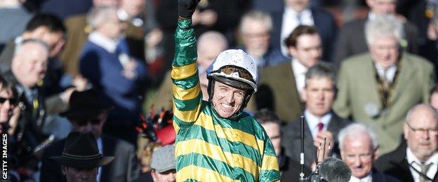 Barry Geraghty celebrates after winning the Champion Hurdle, a second successive win for Buveur D'Air in this event