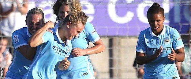 Manchester City's Isobel Christiansen (centre) celebrates scoring her sides second goal with teammates