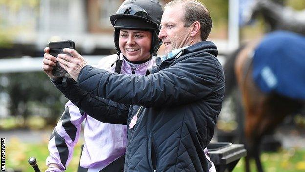 Bryony Frost poses with a racegoer for a selfie