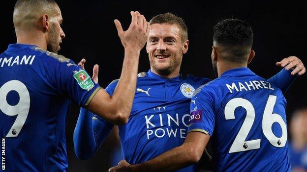 Jamie Vardy celebrates with Riyad Mahrez and Islam Slimani