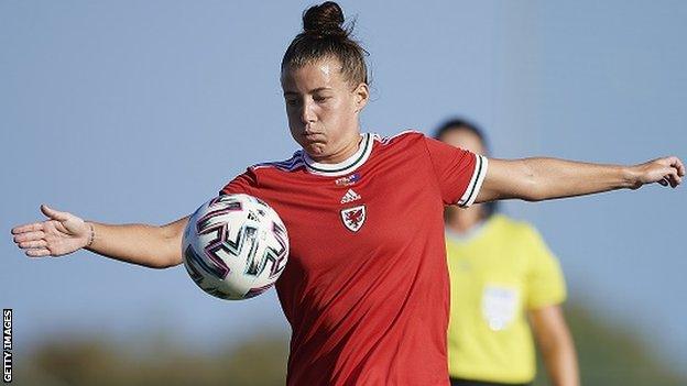 Angharad James controls the ball