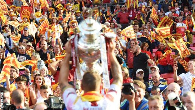 Catalans Dragons fans celebrate the Challenge Cup final win