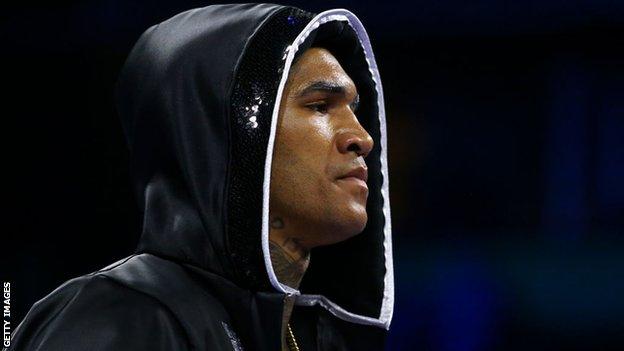 Conor Benn enters the ring in a hood