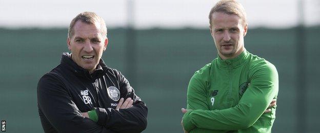 Celtic manager Brendan Rodgers and striker Leigh Griffiths chat at training