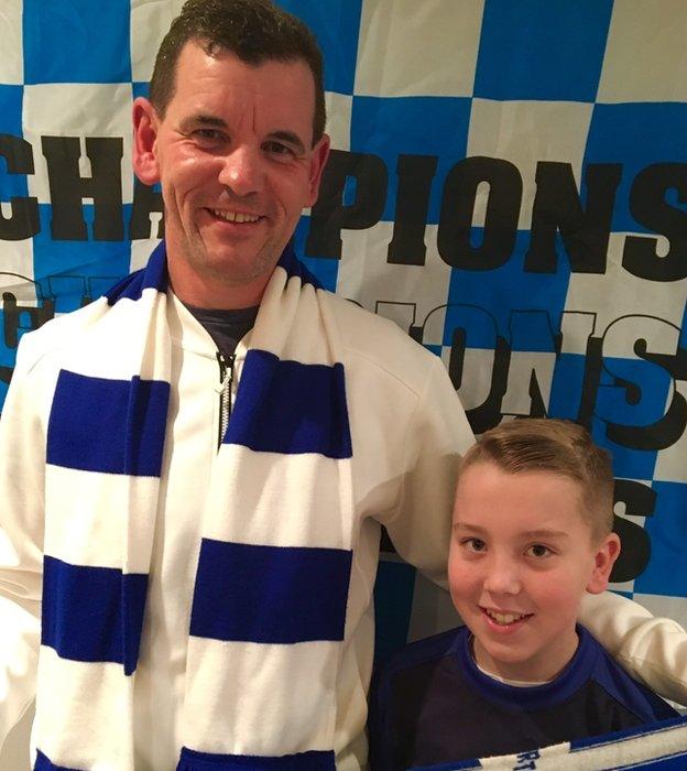 Andrew Darroch prepares for the trip to Hampden with his son Adam, a Morton Under-12s player, who is holding the scarf his dad wore to the semi-final in 1979