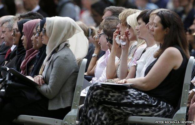 Mourners attend a memorial event