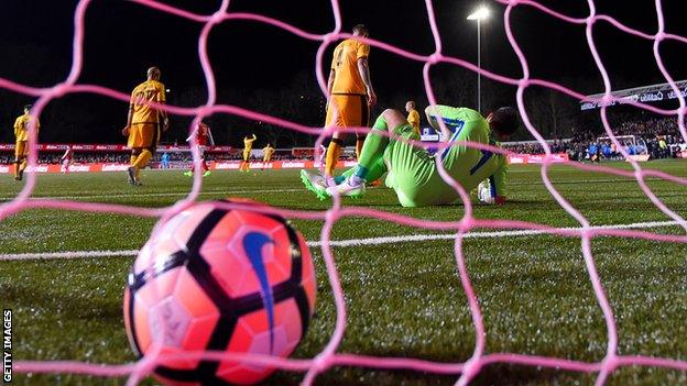 Sutton United concede a goal in their FA Cup fifth-round tie against Arsenal in February 2017