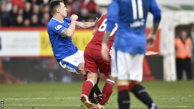 Rangers' Ryan Jack tackles Aberdeen's Stevie May